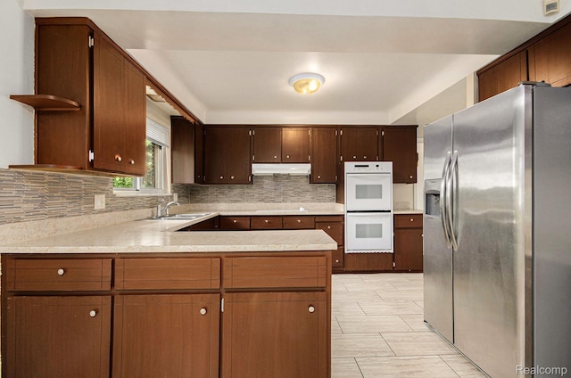 18319 Greenwald Dr, Southfield, MI 48075 - kitchen with stainless steel refrigerator with ice dispenser, white double oven, under cabinet range hood, open shelves, and a peninsula