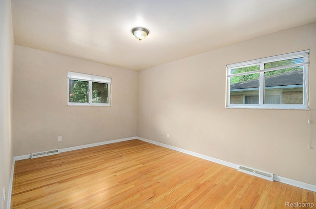 18319 Greenwald Dr, Southfield, MI 48075 - empty room with healthy amount of natural light and wood finished floors