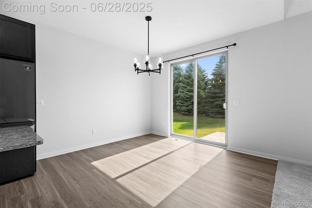 30493 Bradmore Rd, Warren, MI 48092 - unfurnished dining area featuring a chandelier and dark wood-style flooring