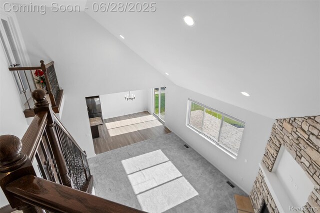 30493 Bradmore Rd, Warren, MI 48092 - living room with high vaulted ceiling, a chandelier, recessed lighting, and wood finished floors