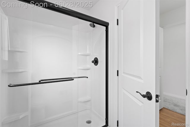 30493 Bradmore Rd, Warren, MI 48092 - bathroom with a shower stall and wood finished floors