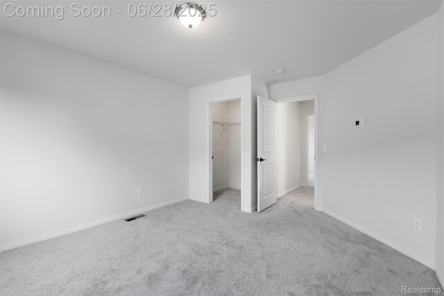 30493 Bradmore Rd, Warren, MI 48092 - unfurnished bedroom featuring carpet floors, a closet, and a spacious closet