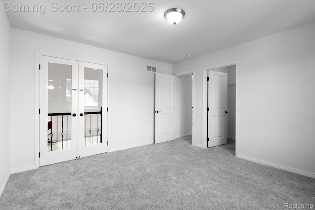 30493 Bradmore Rd, Warren, MI 48092 - unfurnished bedroom featuring french doors and carpet floors