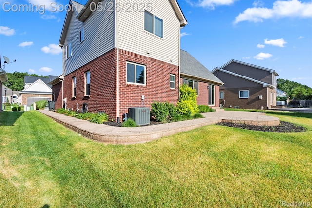 30493 Bradmore Rd, Warren, MI 48092 - back of house featuring brick siding and a yard