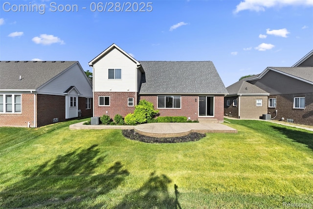 30493 Bradmore Rd, Warren, MI 48092 - back of house featuring brick siding, a patio, and a yard