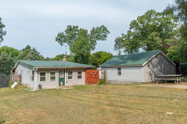 1213 Thomson Rd, Niles, MI 49120 - rear view of house with a metal roof and a chimney