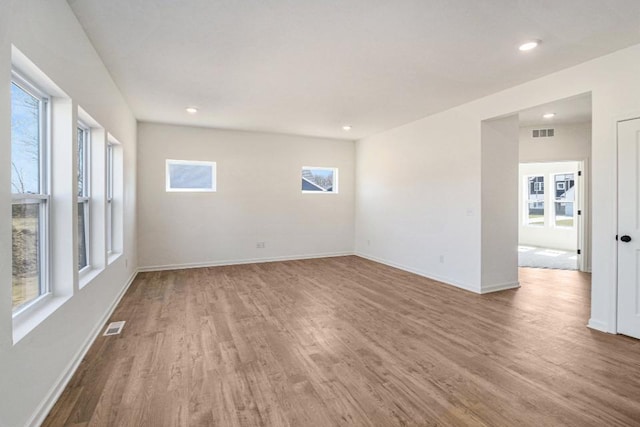 5589 Paxton Ct, Portage, MI 49024 - unfurnished room with wood finished floors, plenty of natural light, and recessed lighting