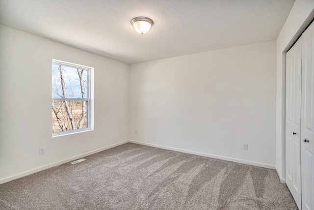 5589 Paxton Ct, Portage, MI 49024 - unfurnished bedroom featuring a closet and carpet flooring