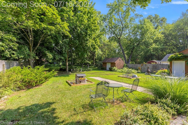21280 Mada Ave, Southfield, MI 48075 - view of yard with a storage shed and a vegetable garden