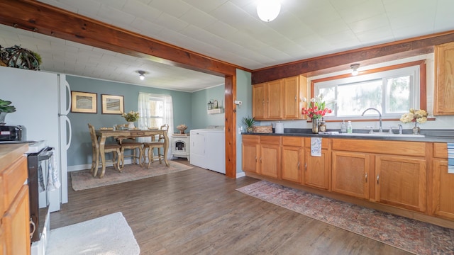 18216 S Schwark Rd, Three Oaks, MI 49128 - kitchen featuring electric range, independent washer and dryer, and dark wood-type flooring