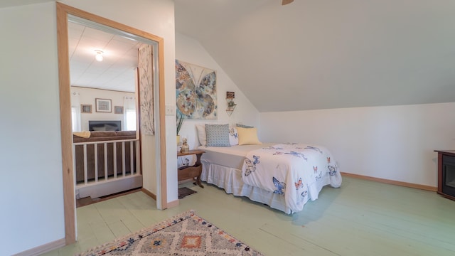 18216 S Schwark Rd, Three Oaks, MI 49128 - bedroom featuring lofted ceiling and wood finished floors