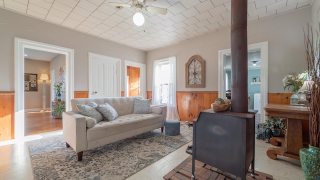 18216 S Schwark Rd, Three Oaks, MI 49128 - living area with a wainscoted wall, a ceiling fan, and wooden walls