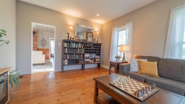 18216 S Schwark Rd, Three Oaks, MI 49128 - living room with wood-type flooring and crown molding