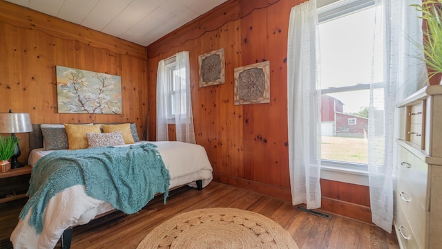 18216 S Schwark Rd, Three Oaks, MI 49128 - bedroom featuring wood walls and wood finished floors