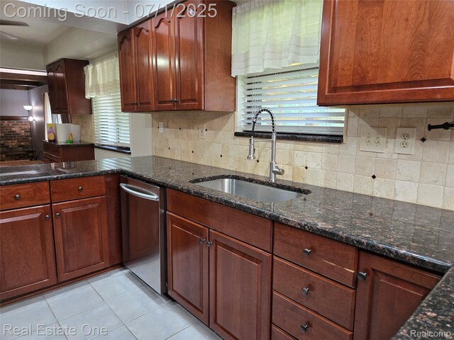 6995 Allen Hill Ct, Clarkston, MI 48348 - kitchen featuring dark stone counters, plenty of natural light, dishwasher, and backsplash
