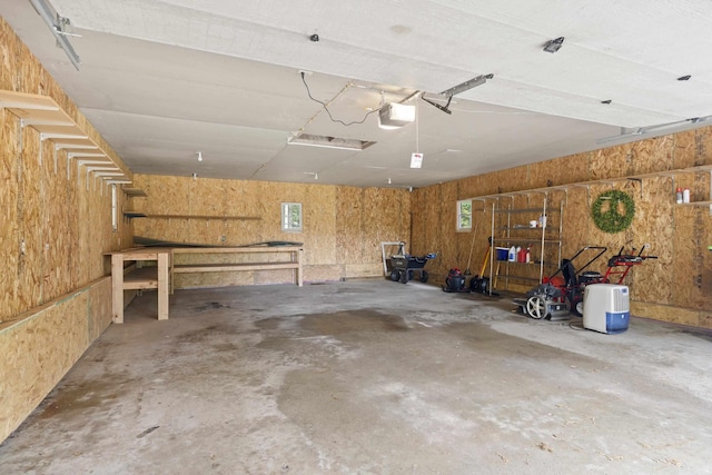 4382 S Vandervoight, Traverse City, MI 49696 - garage with a garage door opener and a workshop area