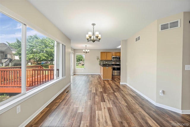 29719 Monterey Cir, Farmington, MI 48336 - unfurnished living room featuring a chandelier and dark wood-type flooring