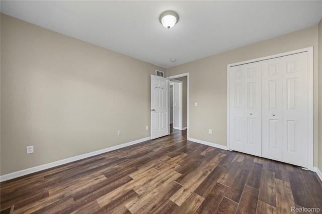 29719 Monterey Cir, Farmington, MI 48336 - unfurnished bedroom with dark wood-type flooring and a closet