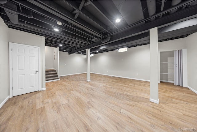 29719 Monterey Cir, Farmington, MI 48336 - finished below grade area featuring stairs and wood finished floors