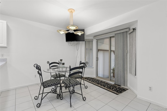 25893 Golf Pointe Dr, Southfield, MI 48075 - tiled dining room featuring baseboards