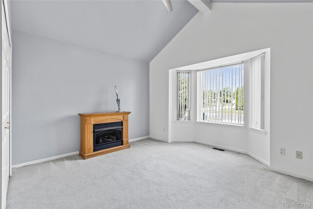 25893 Golf Pointe Dr, Southfield, MI 48075 - unfurnished living room featuring beamed ceiling, carpet, a fireplace, and high vaulted ceiling