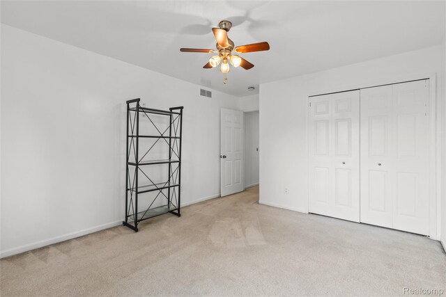 25893 Golf Pointe Dr, Southfield, MI 48075 - unfurnished bedroom featuring carpet flooring, a closet, and ceiling fan