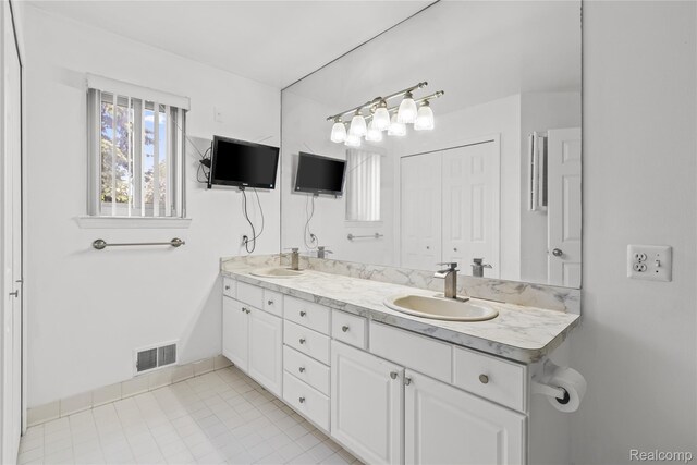 25893 Golf Pointe Dr, Southfield, MI 48075 - full bathroom with double vanity and tile patterned flooring