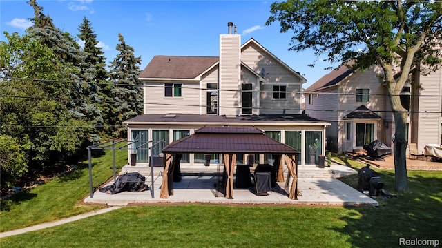 25893 Golf Pointe Dr, Southfield, MI 48075 - back of property with a gazebo, a chimney, a patio area, and a yard
