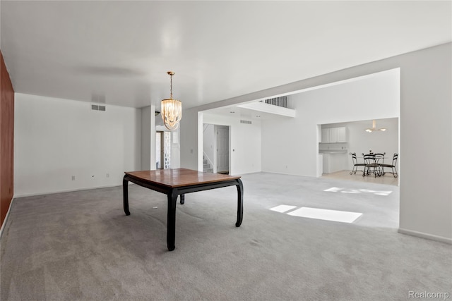 25893 Golf Pointe Dr, Southfield, MI 48075 - unfurnished dining area featuring a chandelier and carpet flooring