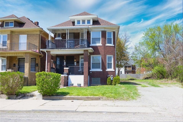 1494 Clairmount Ave, Detroit, MI 48206 - view of front of home featuring brick siding, a balcony, and a front yard