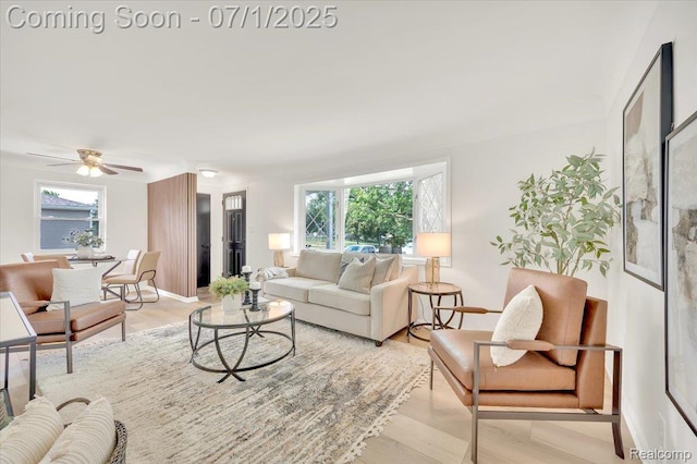 2190 Crescent Lake Rd, Holly, MI 48329 - living area featuring wood finished floors and a ceiling fan