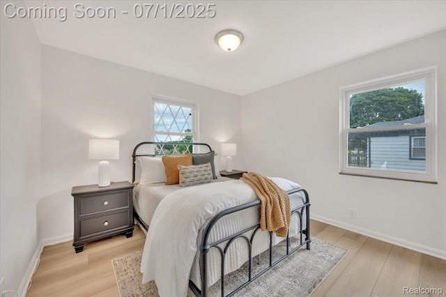 2190 Crescent Lake Rd, Holly, MI 48329 - bedroom featuring light wood-type flooring