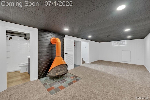 2190 Crescent Lake Rd, Holly, MI 48329 - finished basement featuring carpet, recessed lighting, a wood stove, stairway, and a drop ceiling