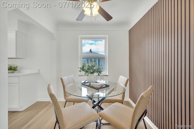2190 Crescent Lake Rd, Holly, MI 48329 - dining room featuring a ceiling fan and light wood-style flooring