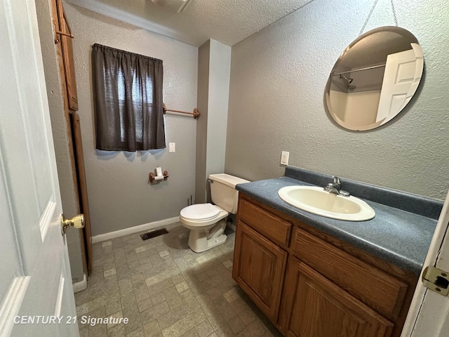2252 N M-18 Rd, Beaverton, MI 48612 - bathroom featuring vanity, a textured ceiling, and brick patterned flooring