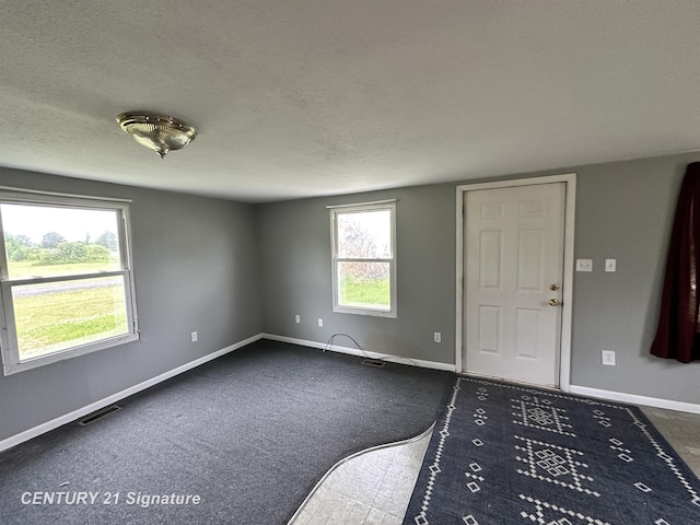 2252 N M-18 Rd, Beaverton, MI 48612 - foyer entrance featuring a textured ceiling