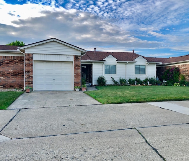 8681 Tucson Ct, Warren, MI 48093 - ranch-style house with a front yard, concrete driveway, an attached garage, and brick siding
