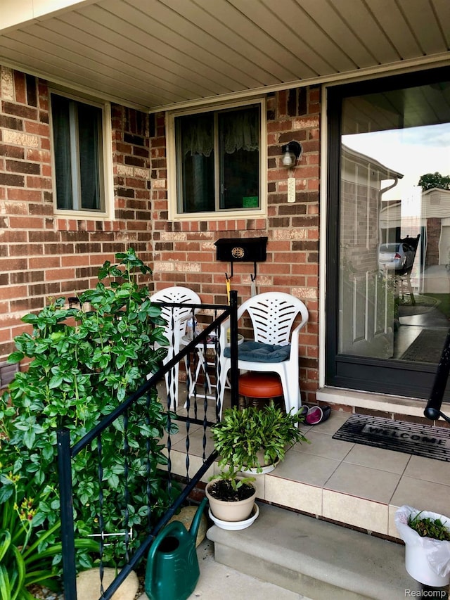 8681 Tucson Ct, Warren, MI 48093 - doorway to property with brick siding
