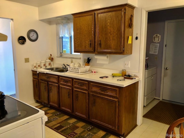8681 Tucson Ct, Warren, MI 48093 - kitchen featuring electric range, light countertops, and washer / dryer