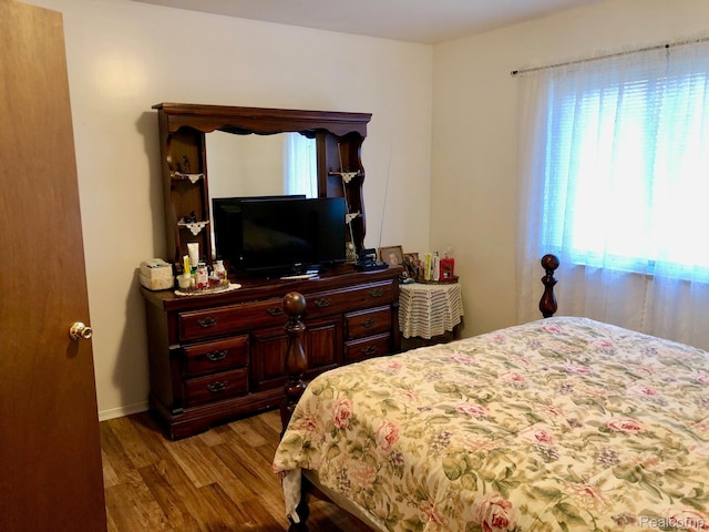 8681 Tucson Ct, Warren, MI 48093 - bedroom with wood finished floors and baseboards