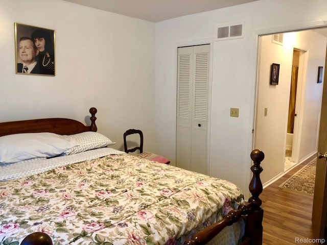 8681 Tucson Ct, Warren, MI 48093 - bedroom featuring wood finished floors and a closet