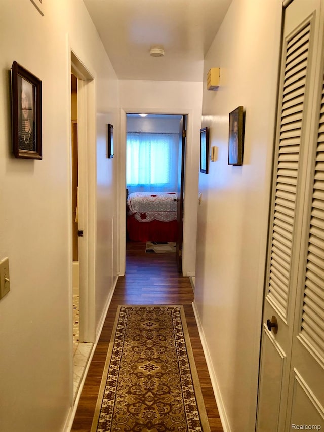 8681 Tucson Ct, Warren, MI 48093 - hallway featuring dark wood-style flooring