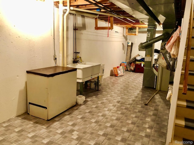8681 Tucson Ct, Warren, MI 48093 - unfinished below grade area featuring a sink