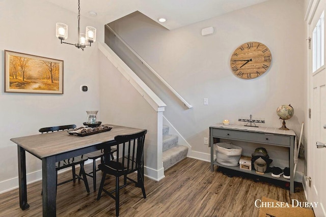 611 Bedford Falls Dr, Sparta, MI 49345 - dining area with stairs, wood finished floors, and a chandelier