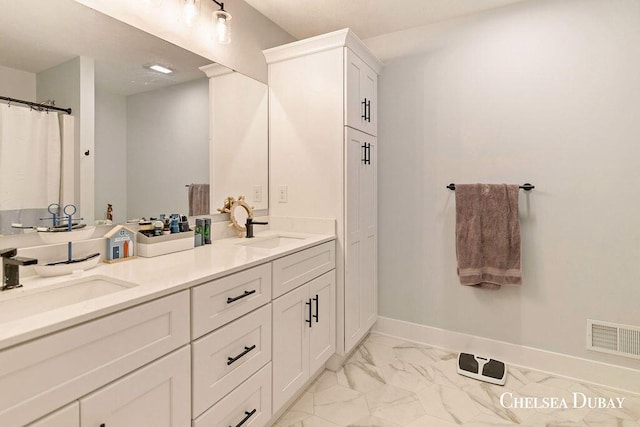 611 Bedford Falls Dr, Sparta, MI 49345 - full bathroom with double vanity and marble finish floors