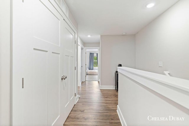 611 Bedford Falls Dr, Sparta, MI 49345 - hall with dark wood-style floors, an upstairs landing, and recessed lighting