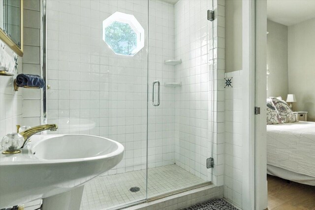 46210 Perkins Blvd, New Buffalo, MI 49117 - full bath featuring ensuite bath, a shower stall, and wood finished floors