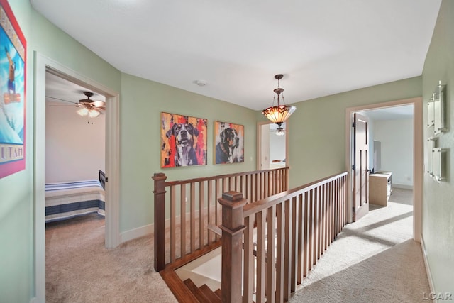 4078 Woodland Ave, Manitou Beach, MI 49253 - hall featuring carpet floors and an upstairs landing