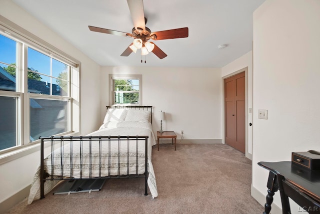4078 Woodland Ave, Manitou Beach, MI 49253 - carpeted bedroom with baseboards and a ceiling fan