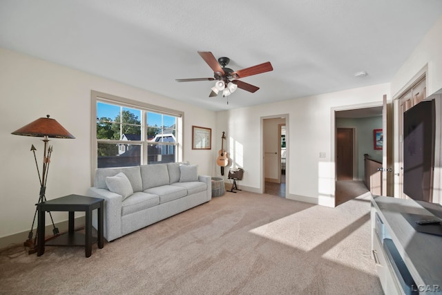 4078 Woodland Ave, Manitou Beach, MI 49253 - living area with light carpet and a ceiling fan